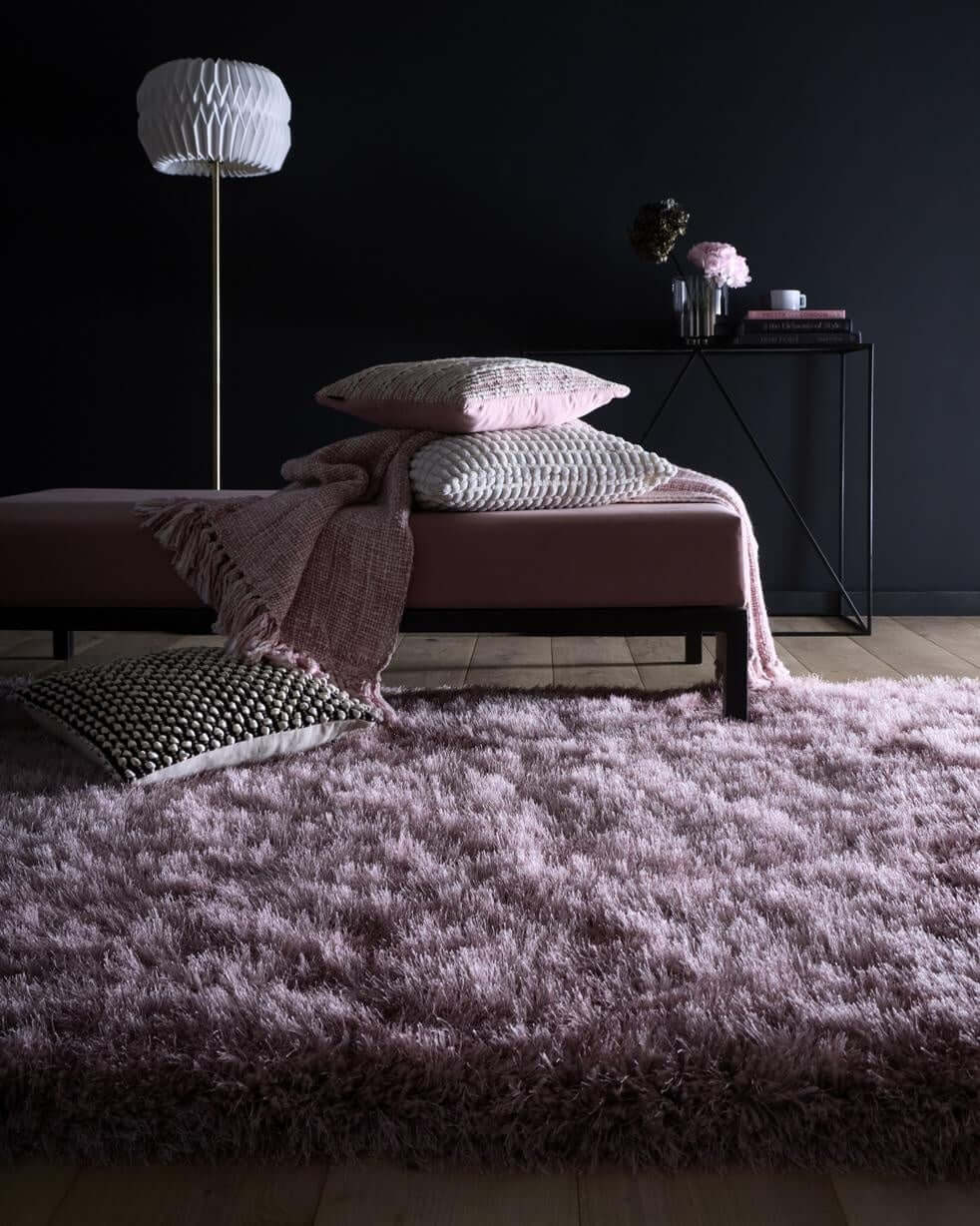 Soft pink Shaggy Rug in a modern living space with decorative cushions
