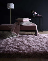 Soft pink Shaggy Rug in a modern living space with decorative cushions
