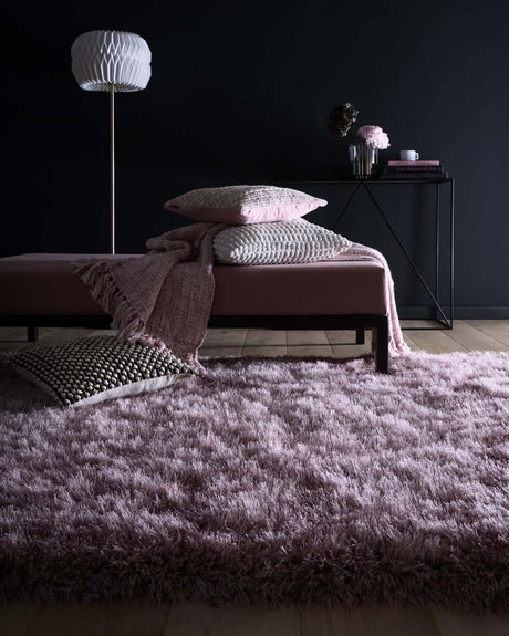 Soft pink Shaggy Rug in a modern living space with decorative cushions