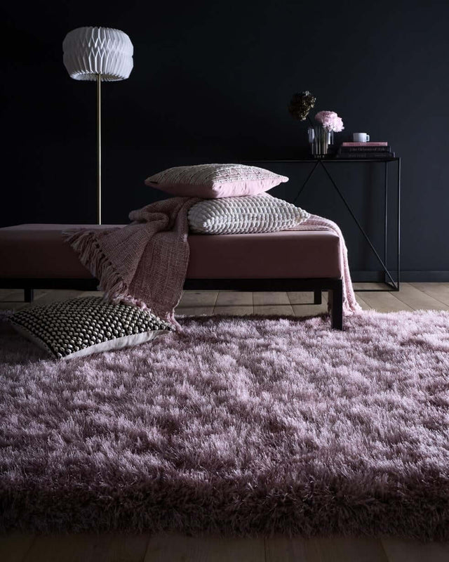 Soft pink Shaggy Rug in a modern living space with decorative cushions
