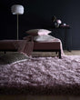 Soft pink Shaggy Rug in a modern living space with decorative cushions