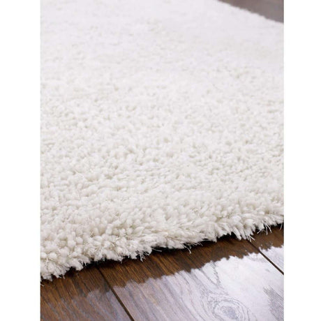 Soft White Shaggy Rug on Hardwood Floor, Perfect for a Cozy Living Space