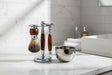 Eco Bath London Shaving Set featuring a chrome stand, wooden handle brush, and stainless steel bowl
