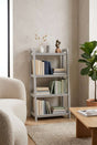 Orsina Shelf Unit in Grey Displaying Books and Decorative Items in a Modern Living Room