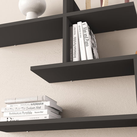 Decortie Floating Shelf in sleek black design showcasing books and decor items