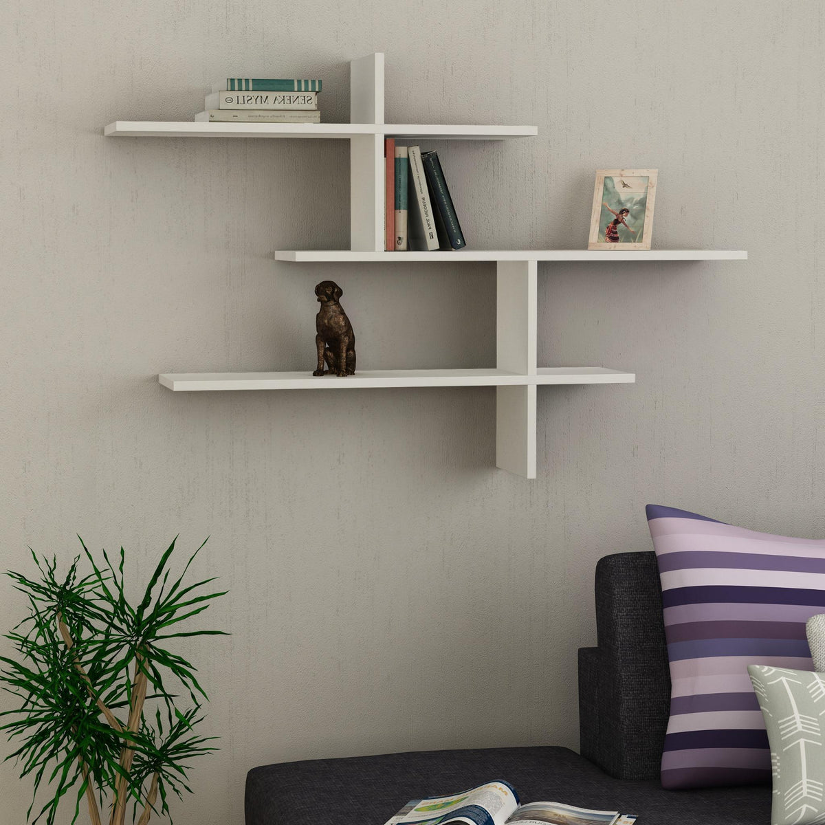 Decortie Floating Shelf in white with geometric design for displaying books and decor items