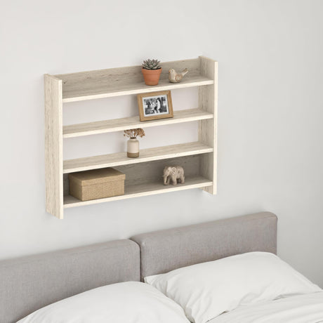 Decortie Wall Shelf with three shelves, styled with plants and decor above a bed