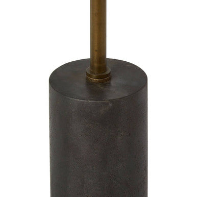 Orsina Side Table with a sleek cylindrical design and a contrasting brass accent