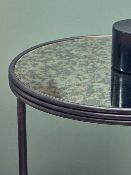 Orsina Side Table with a stylish round glass top and metal base, perfect for modern interiors