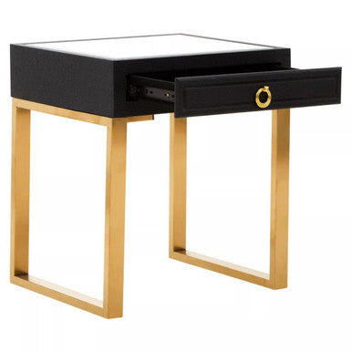 Orsina stylish side table with a black finish, gold legs, and a single drawer for storage