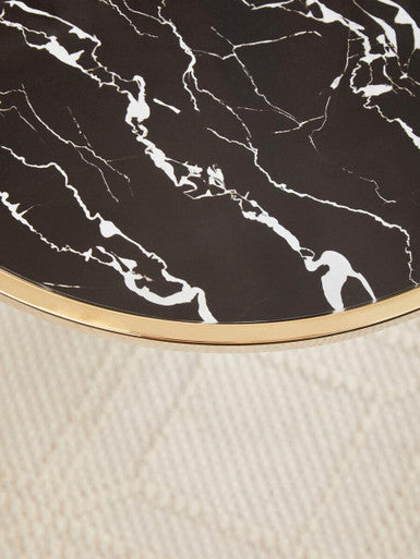 Elegant Orsina side table with a black marble top and gold trim for modern home decor