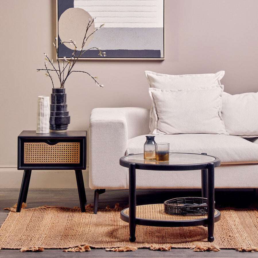 Orsina Side Table featuring a modern design with rattan accents and a sleek black finish