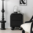 Modern black side table by Nisu Home with rounded corners and stylish design in a chic living room setting