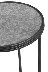 Orsina modern round side table with a textured grey surface and sleek black metal legs