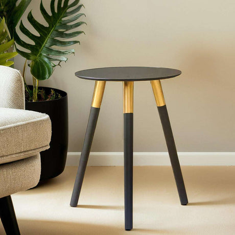 Orsina Side Table with a sleek round top and gold-accented legs, perfect for modern living spaces