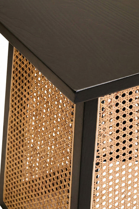 Orsina Side Table featuring a sleek black top and woven rattan sides for modern decor