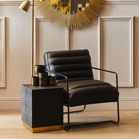 Orsina Side Table with a sleek design, complementing a modern chair and stylish decor