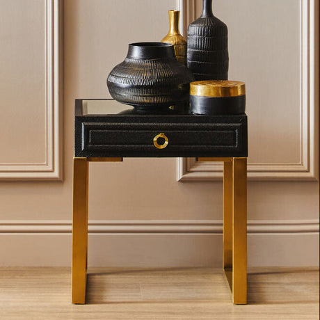 Orsina Side Table with a sleek design, featuring a drawer and decorative vases on top