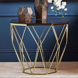 Orsina Side Table with a geometric gold metal base and a sleek black top, perfect for modern interiors