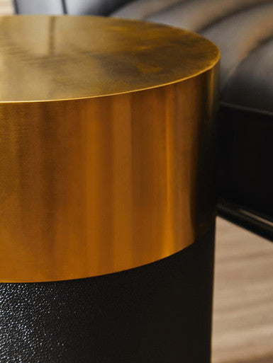 Stylish Orsina Side Table with a sleek gold top and textured black base for modern interiors