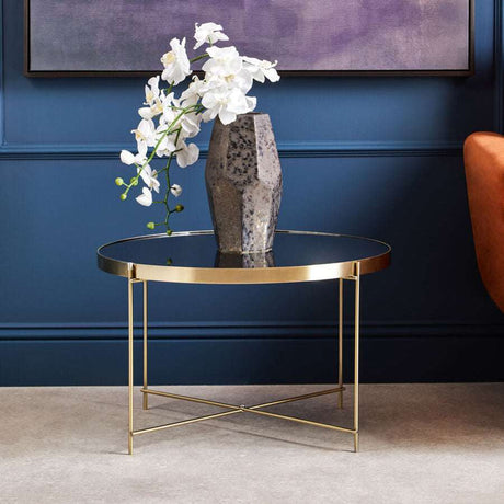 Orsina Side Table with a Gold Frame and Black Glass Top, featuring a Decorative Vase and Flowers