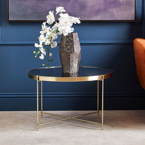 Orsina Side Table with a Gold Frame and Black Glass Top, featuring a Decorative Vase and Flowers