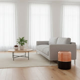 Orsina Side Table with a modern design, featuring a wooden top and sleek metal legs in a stylish living room