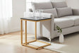 Orsina side table with a black top and gold metal frame, perfect beside a modern sofa