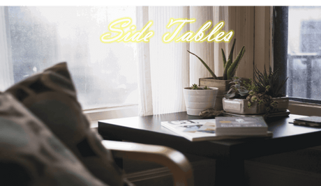 Stylish Orsina Side Table beside a window with plants and magazines on top