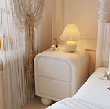 Nisu Home Modern Side Table with Soft Curves and a Stylish Lamp in a Chic Bedroom Setting