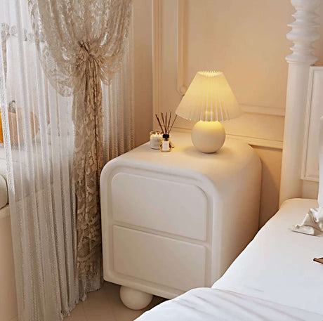 Nisu Home Modern Side Table with Soft Curves and a Stylish Lamp in a Chic Bedroom Setting