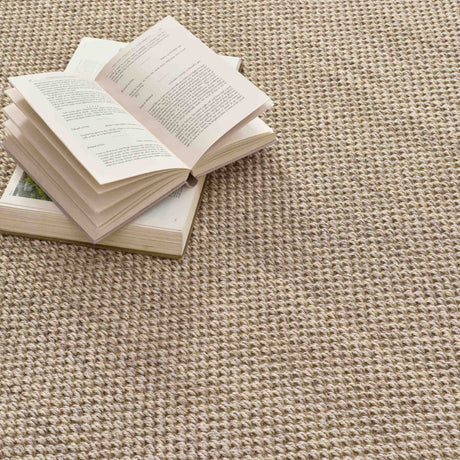 Natural textured Sisal Rug with an open book placed on it for a cozy, inviting feel