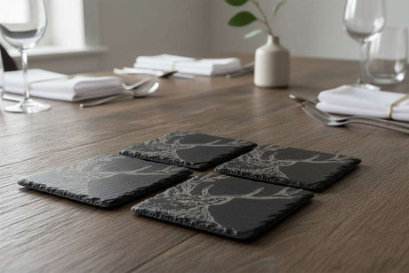 Selbrae House Slate Gift Set featuring four coasters with elegant tree designs for upscale dining