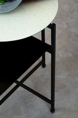 Orsina Side Table with a sleek black base and a speckled white tabletop design