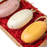 Eco Bath London Gift Box featuring three colourful Soap On A Rope bars nestled in red straw