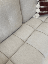Comfortable grey 2-Seater Sofa with soft fabric and stylish quilted design