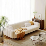 Stylish Nisu Home sofa in a modern living room with decorative cushions and a warm throw
