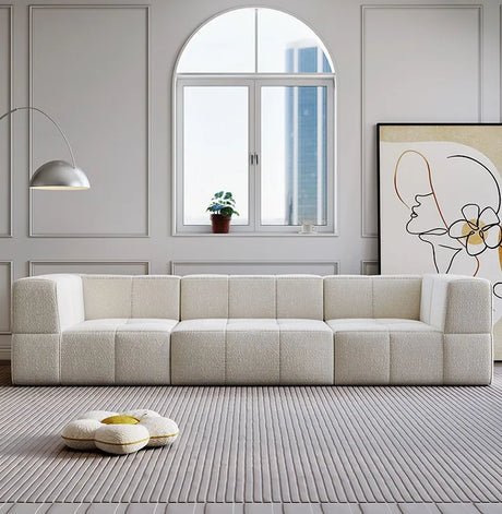 Modern Nisu Home sofa in cream upholstery with a minimalist design and geometric shapes