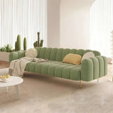 Stylish Nisu Home green sofa with plush cushions and curved design for modern living spaces