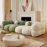 Nisu Home contemporary sofa with organic shapes in green and cream, set in a stylish living room