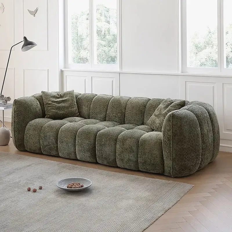 Nisu Home plush green sofa with a contemporary design and comfy cushions for stylish interiors