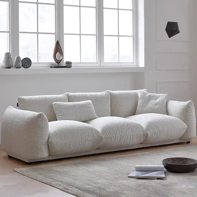 Nisu Home plush white sofa with large back cushions and sleek design for modern living spaces