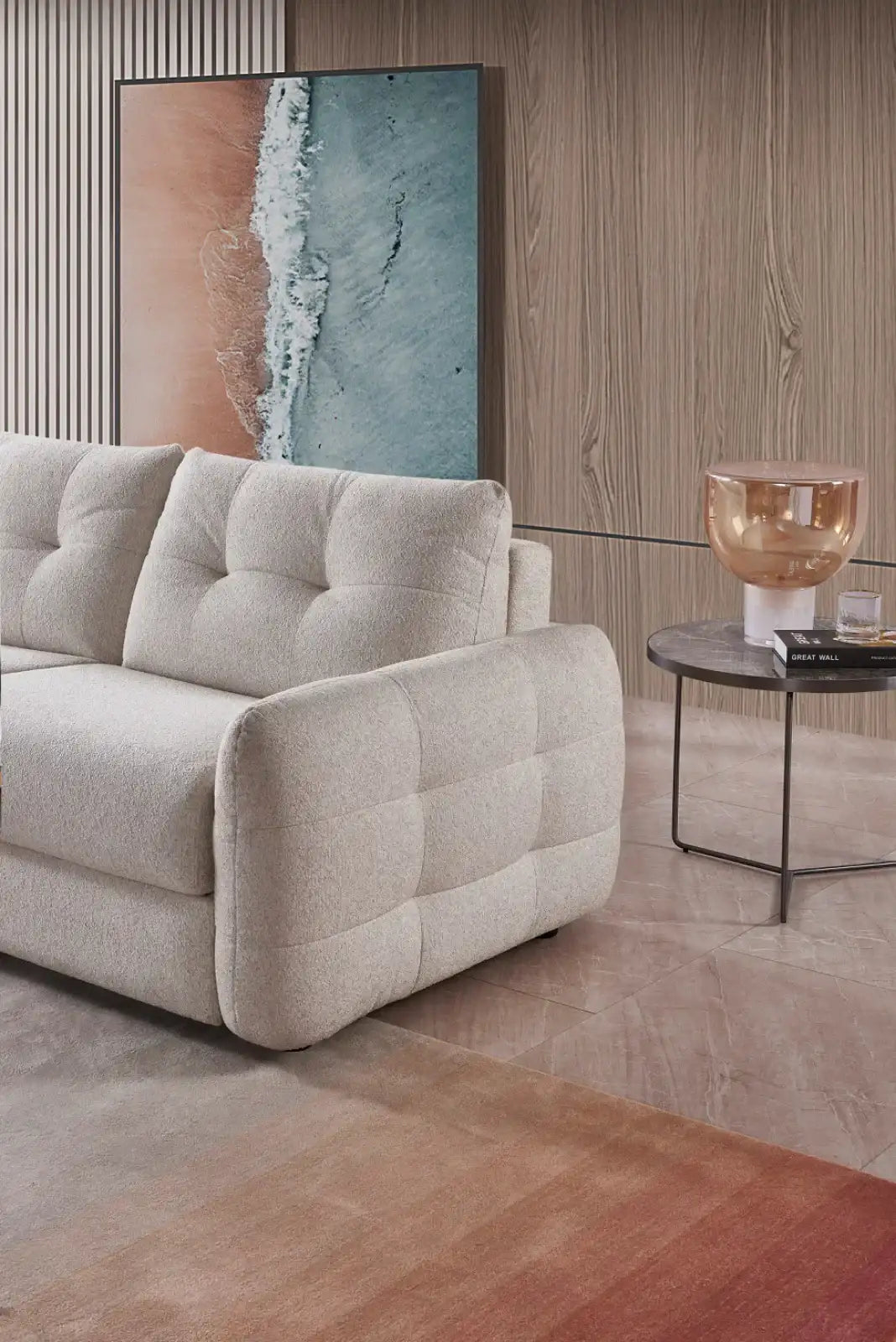 Stylish plush soft grey sofabed with tufted design for modern living spaces