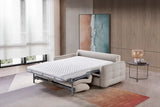Stylish modern sofabed in a spacious living room with a quilted mattress pulled out
