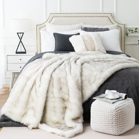 Luxurious Nisu Home faux fur throw blanket draped elegantly over a bed for added warmth and style