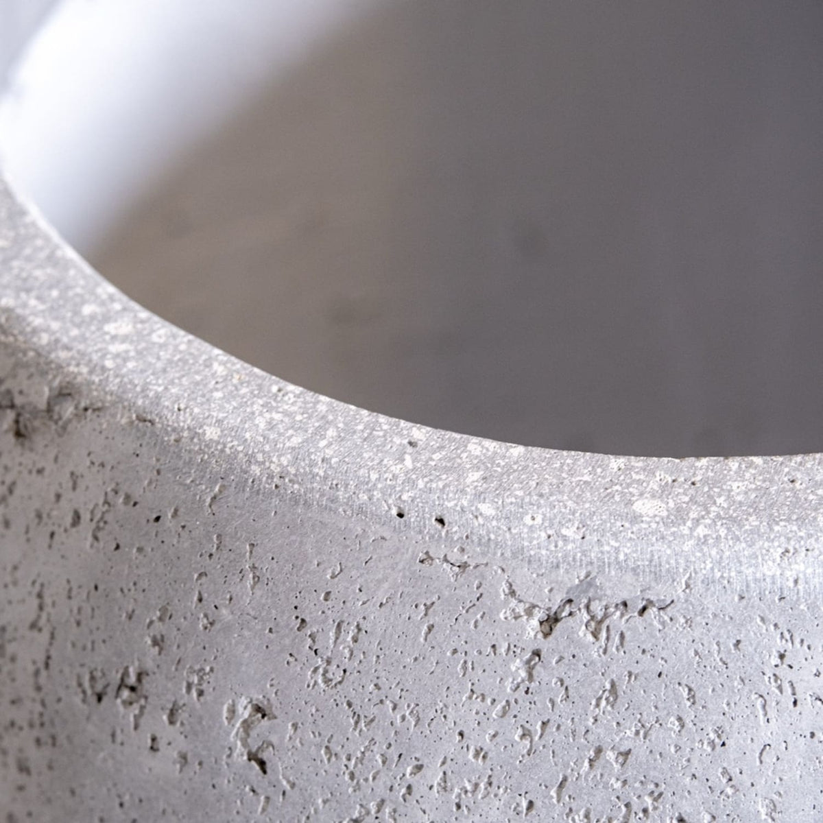 Close-up of Jobu Home Sphere Planter featuring textured concrete finish for contemporary plant display