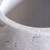 Close-up of Jobu Home Sphere Planter featuring textured concrete finish for contemporary plant display