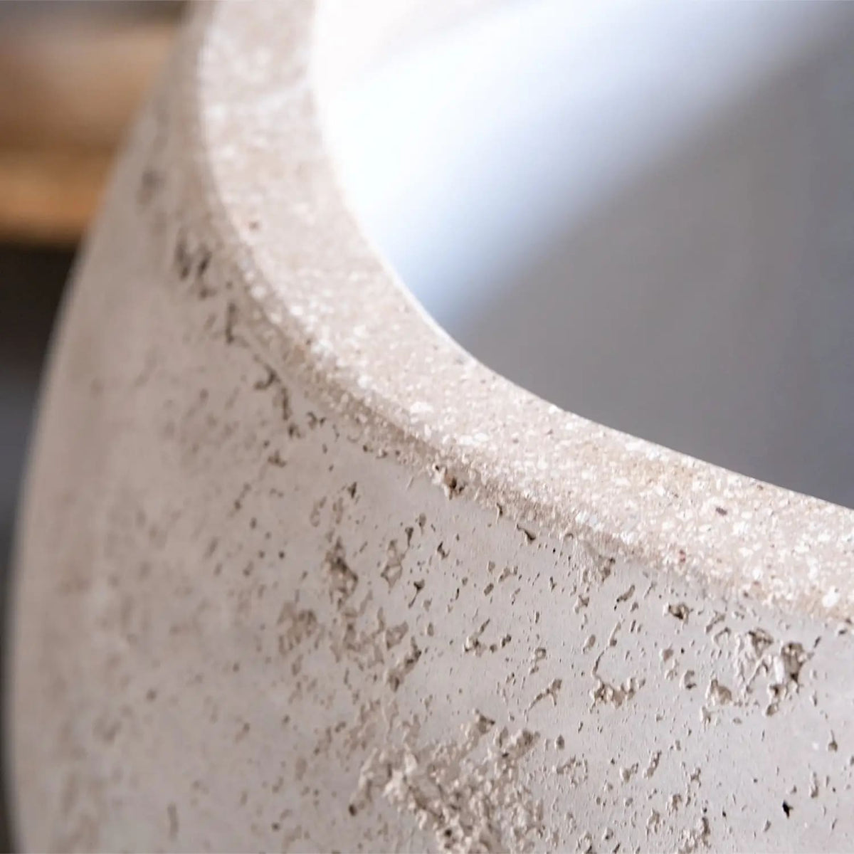 Close-up of a textured concrete Sphere Planter from Jobu Home with a minimalist design