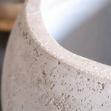 Close-up of a textured concrete Sphere Planter from Jobu Home with a minimalist design