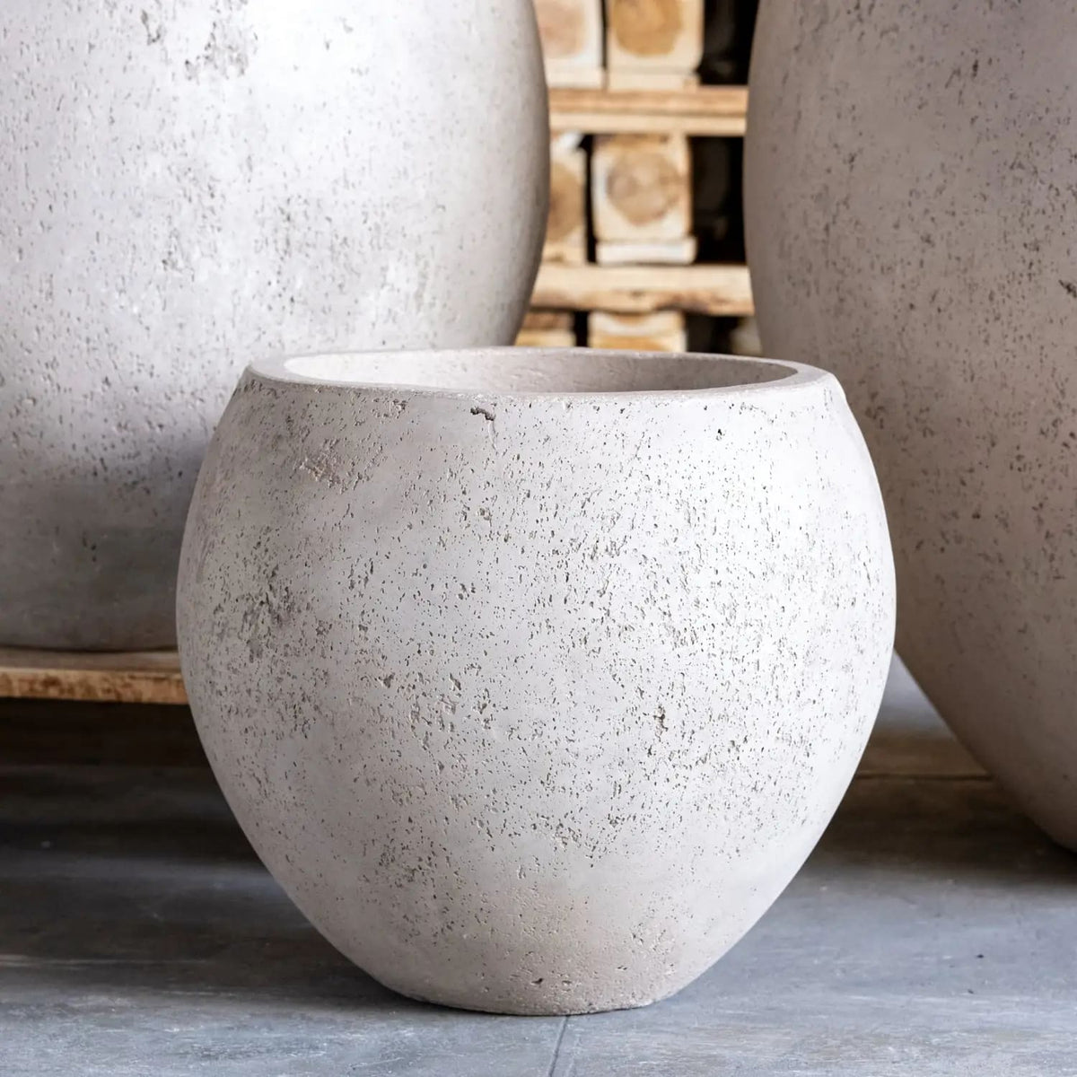 Jobu Home Sphere Planter in textured light grey stone for indoor and outdoor plants